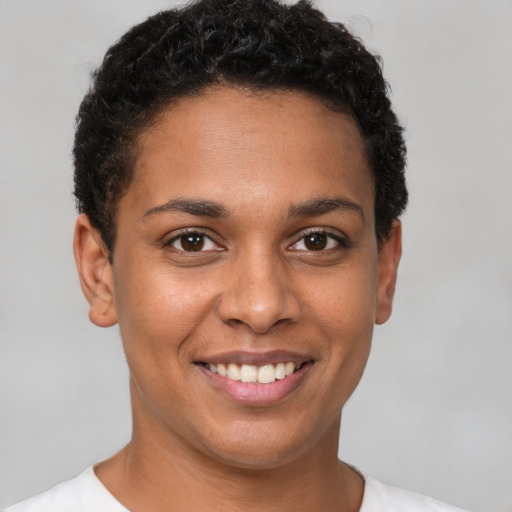 Joyful latino young-adult female with short  brown hair and brown eyes