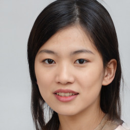 Joyful asian young-adult female with medium  black hair and brown eyes