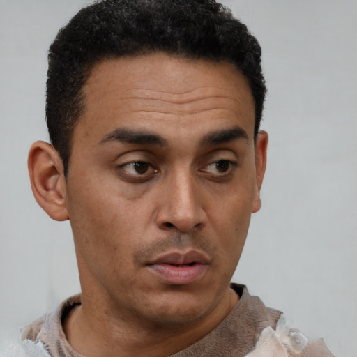 Neutral latino young-adult male with short  brown hair and brown eyes