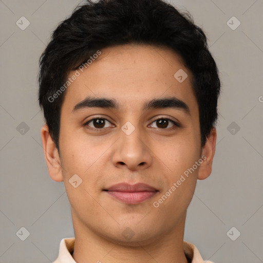 Joyful latino young-adult male with short  black hair and brown eyes