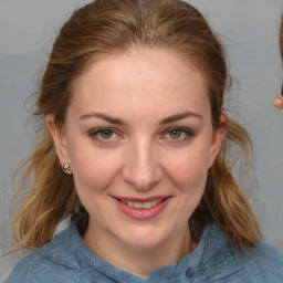 Joyful white young-adult female with medium  brown hair and blue eyes