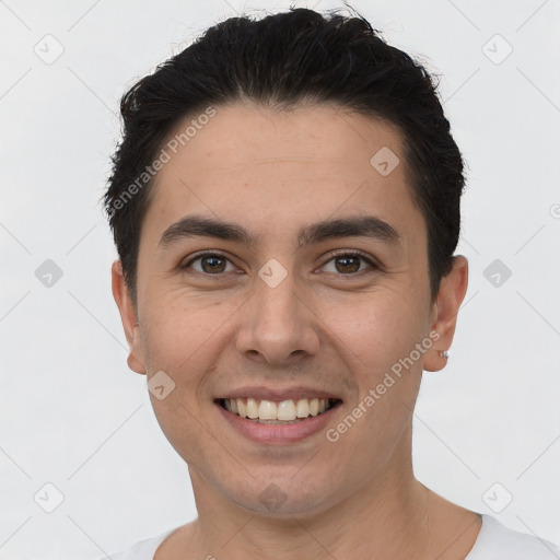 Joyful white young-adult male with short  black hair and brown eyes