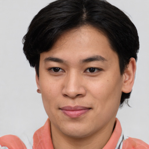Joyful asian young-adult male with short  brown hair and brown eyes