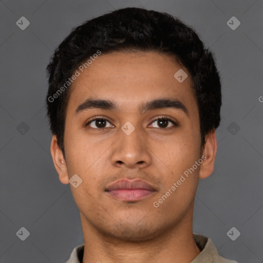 Neutral latino young-adult male with short  black hair and brown eyes