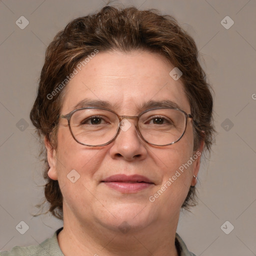 Joyful white adult female with medium  brown hair and blue eyes