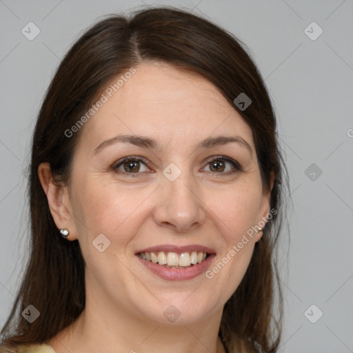 Joyful white adult female with medium  brown hair and brown eyes