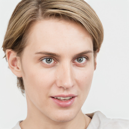 Joyful white young-adult female with short  brown hair and blue eyes