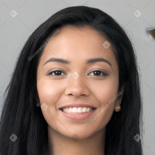 Joyful latino young-adult female with long  black hair and brown eyes