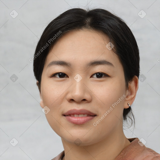 Joyful asian young-adult female with short  brown hair and brown eyes