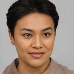 Joyful asian young-adult female with short  brown hair and brown eyes