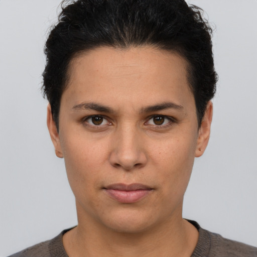 Neutral white young-adult female with short  brown hair and brown eyes