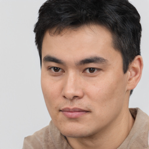 Neutral asian young-adult male with short  brown hair and brown eyes