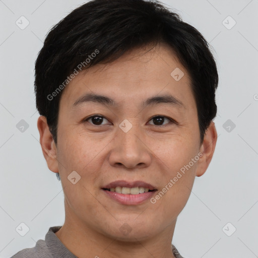 Joyful asian young-adult male with short  brown hair and brown eyes