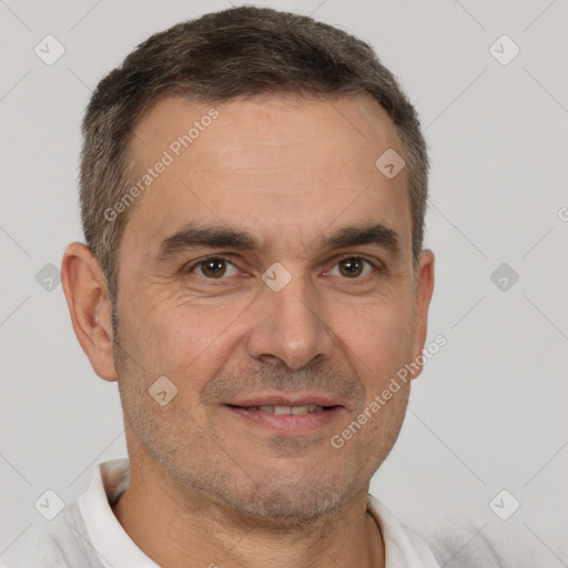 Joyful white adult male with short  brown hair and brown eyes