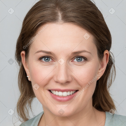 Joyful white young-adult female with medium  brown hair and blue eyes