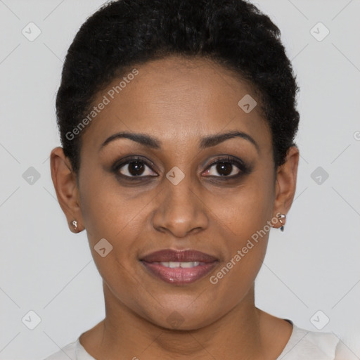 Joyful black young-adult female with short  brown hair and brown eyes