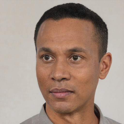 Neutral black adult male with short  black hair and brown eyes