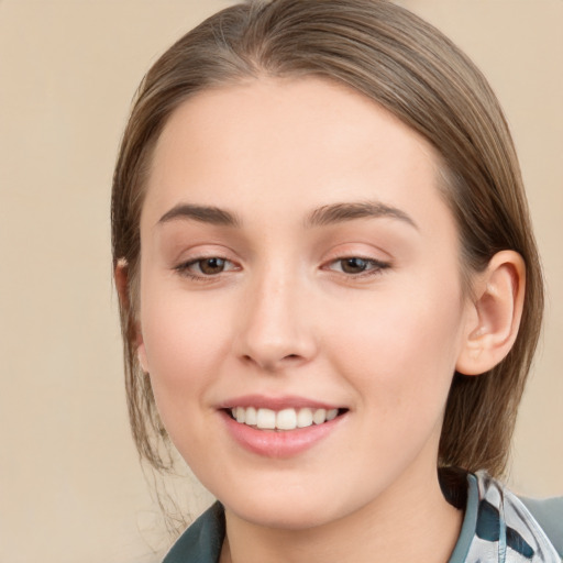 Joyful white young-adult female with medium  brown hair and grey eyes