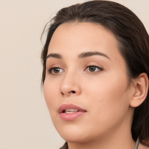 Neutral white young-adult female with medium  brown hair and brown eyes