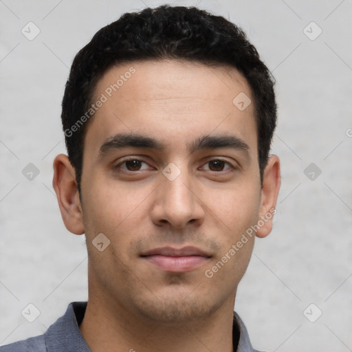 Joyful white young-adult male with short  black hair and brown eyes