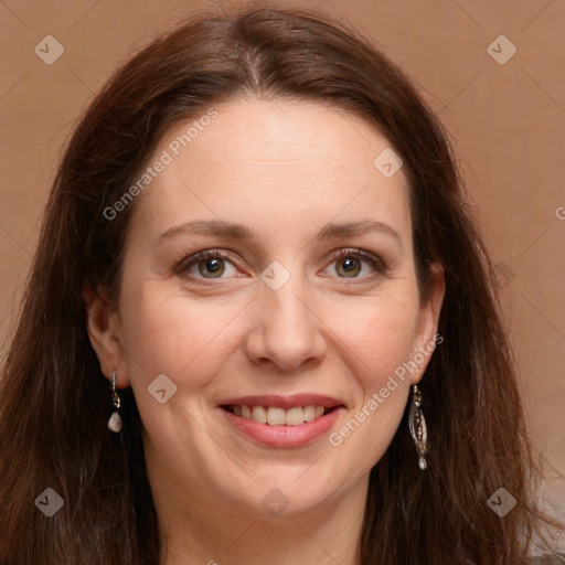 Joyful white adult female with long  brown hair and green eyes