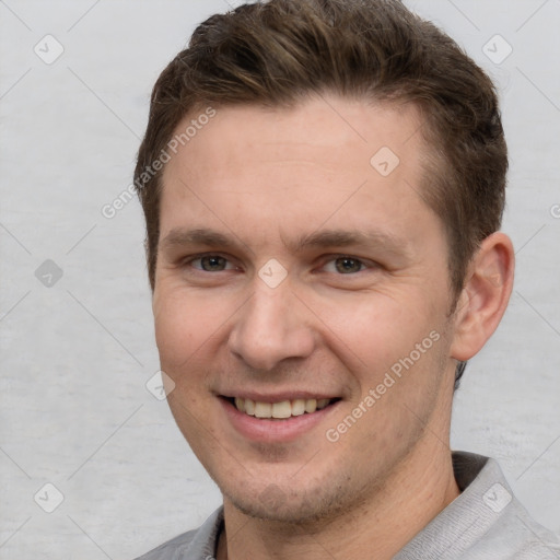 Joyful white young-adult male with short  brown hair and brown eyes