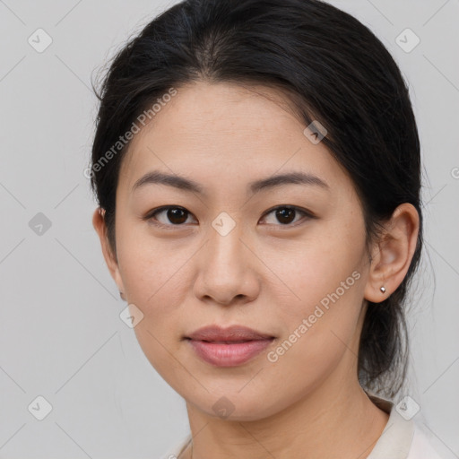 Joyful asian young-adult female with medium  brown hair and brown eyes