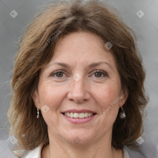 Joyful white adult female with medium  brown hair and grey eyes