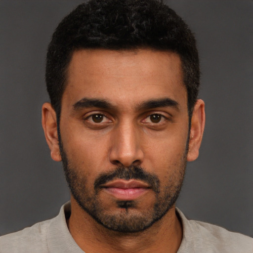 Neutral black young-adult male with short  black hair and brown eyes
