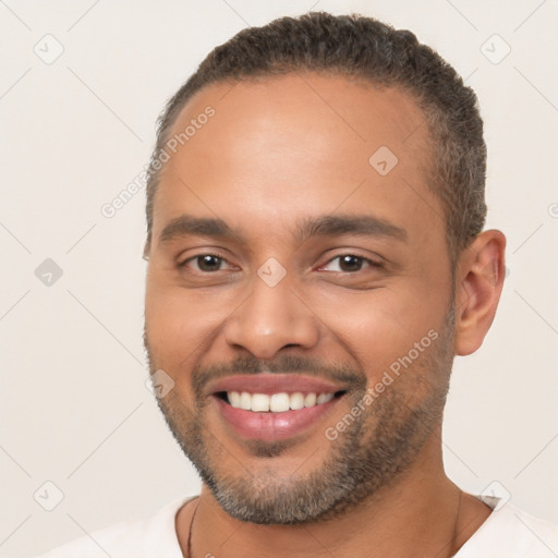 Joyful white young-adult male with short  brown hair and brown eyes