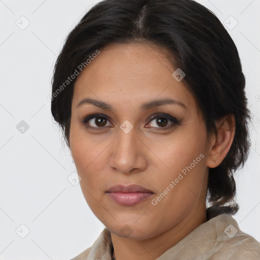 Joyful latino young-adult female with medium  brown hair and brown eyes