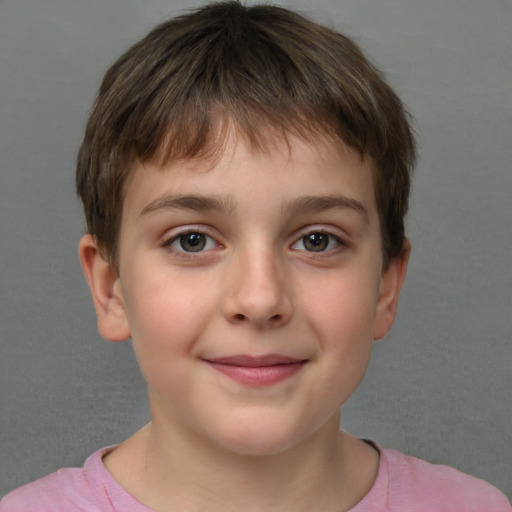 Joyful white child male with short  brown hair and brown eyes