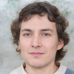 Joyful white young-adult male with medium  brown hair and brown eyes