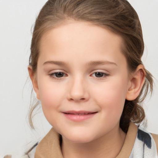 Joyful white child female with medium  brown hair and brown eyes