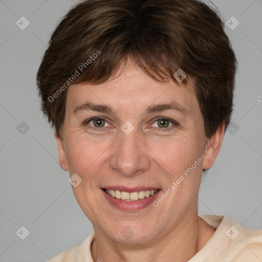 Joyful white adult female with short  brown hair and grey eyes