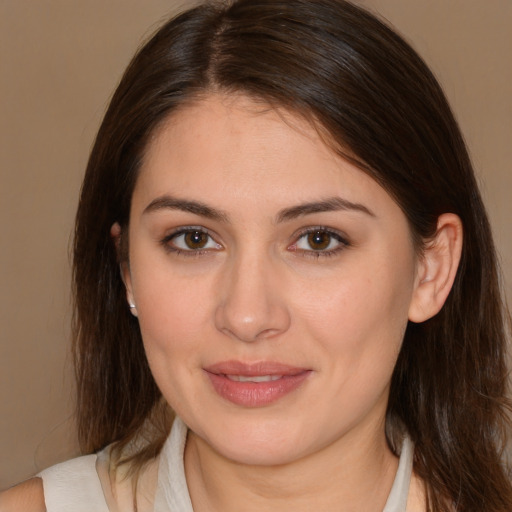 Joyful white young-adult female with medium  brown hair and brown eyes