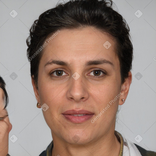 Joyful white adult female with short  brown hair and brown eyes