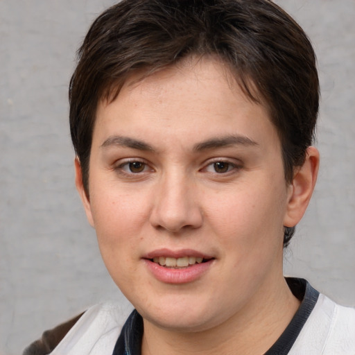 Joyful white young-adult female with short  brown hair and brown eyes