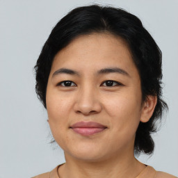 Joyful asian young-adult female with medium  brown hair and brown eyes