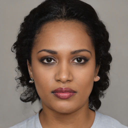 Neutral black young-adult female with medium  black hair and brown eyes