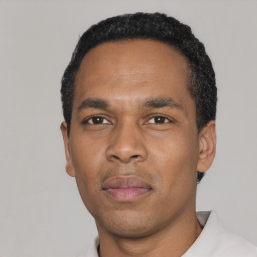 Neutral black young-adult male with short  black hair and brown eyes