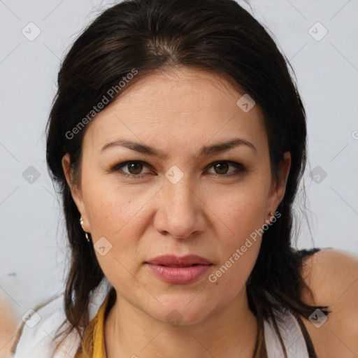 Joyful white adult female with medium  brown hair and brown eyes