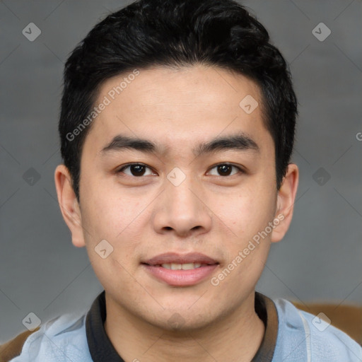 Joyful asian young-adult male with short  black hair and brown eyes