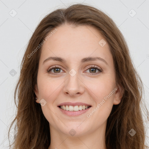 Joyful white young-adult female with long  brown hair and grey eyes