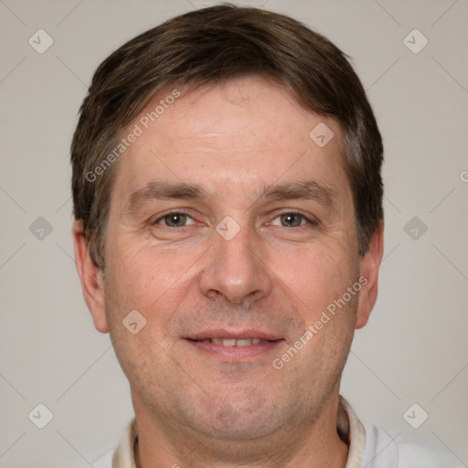 Joyful white adult male with short  brown hair and grey eyes