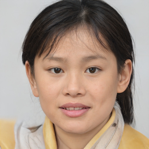 Joyful white child female with medium  brown hair and brown eyes