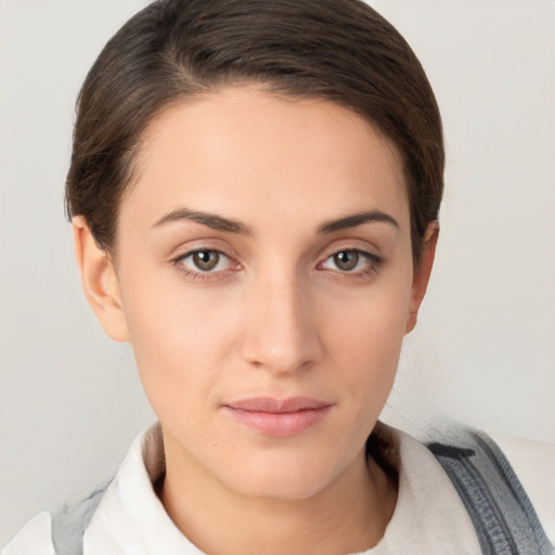 Neutral white young-adult female with short  brown hair and brown eyes