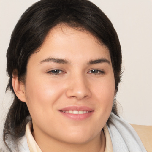 Joyful white young-adult female with medium  brown hair and brown eyes