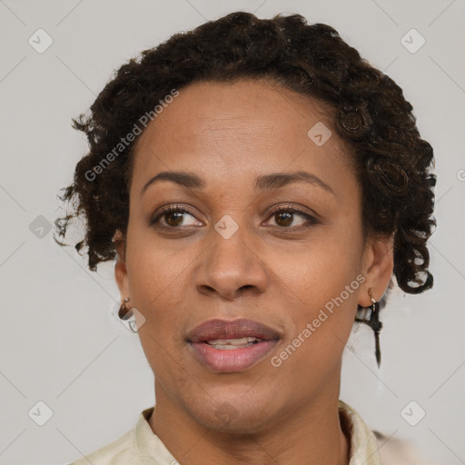 Joyful black adult female with short  brown hair and brown eyes