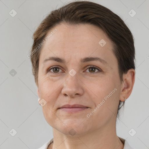 Joyful white adult female with short  brown hair and brown eyes